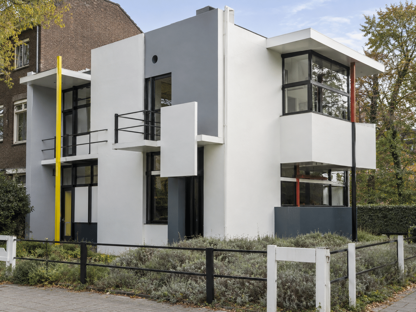 AI-generated editorial illustration of the Rietveld Schröder House by Gerrit Rietveld in Utrecht, showing geometric forms and coloured planes.